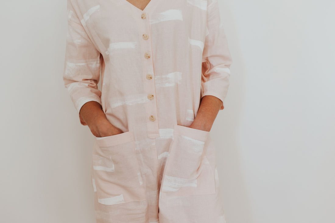 Our first hand-painted jumpsuit. Baby pink.